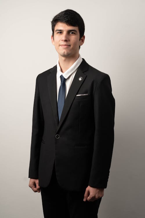 A young man in a suit and tie