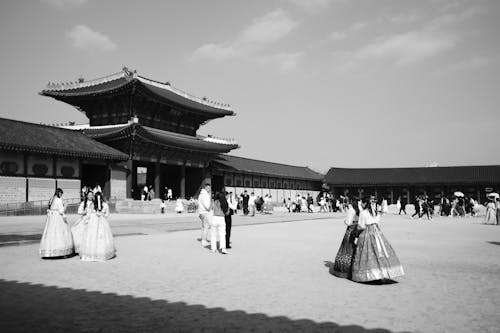 Black and white photo of people in traditional dress