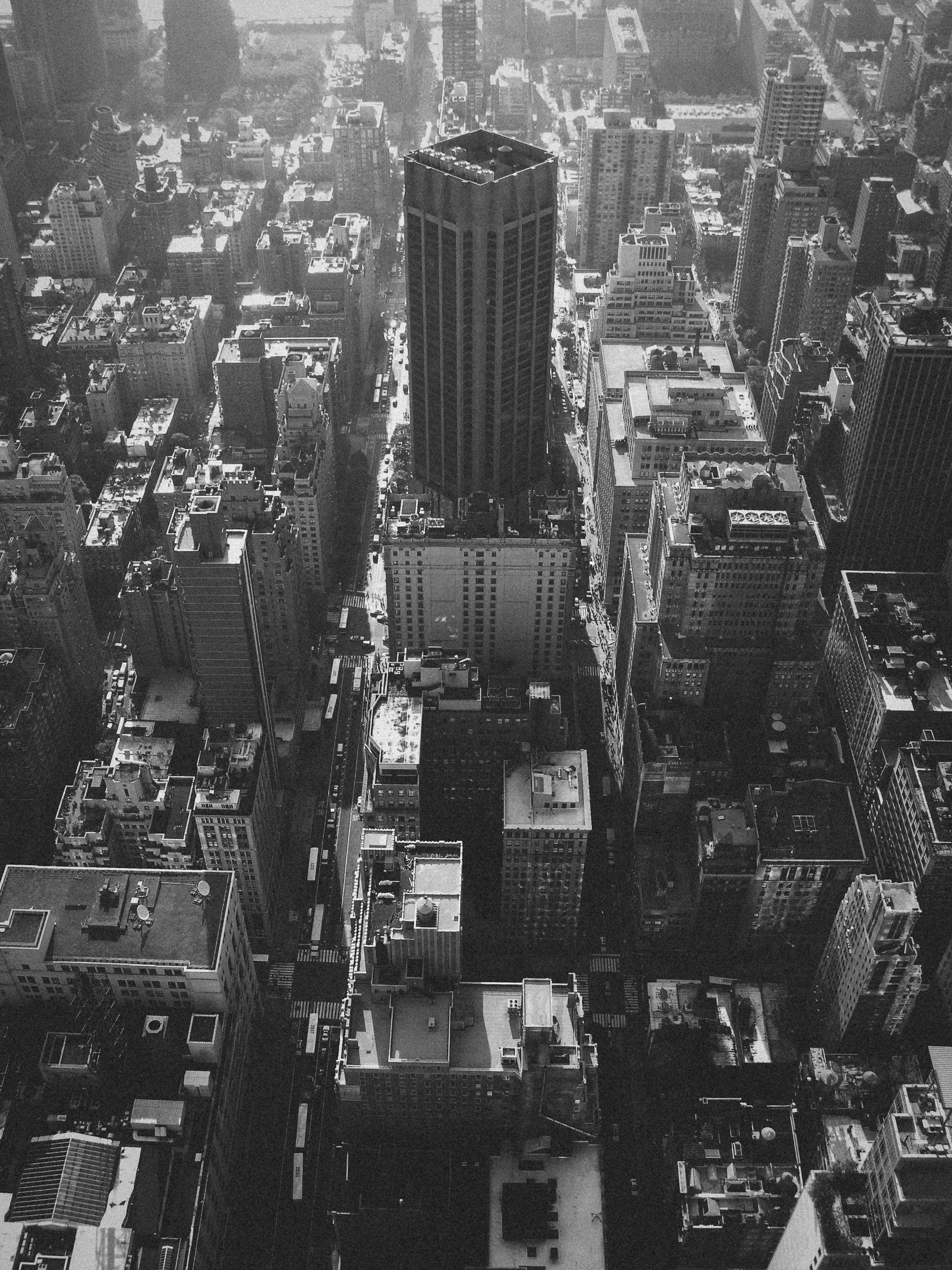 Experience the timeless elegance of NYC with this grayscale aerial view showcasing iconic skyscrapers and urban architecture.