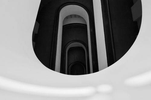 Free Artistic perspective of modern spiral staircase in Vatican Museums, captured in grayscale. Stock Photo