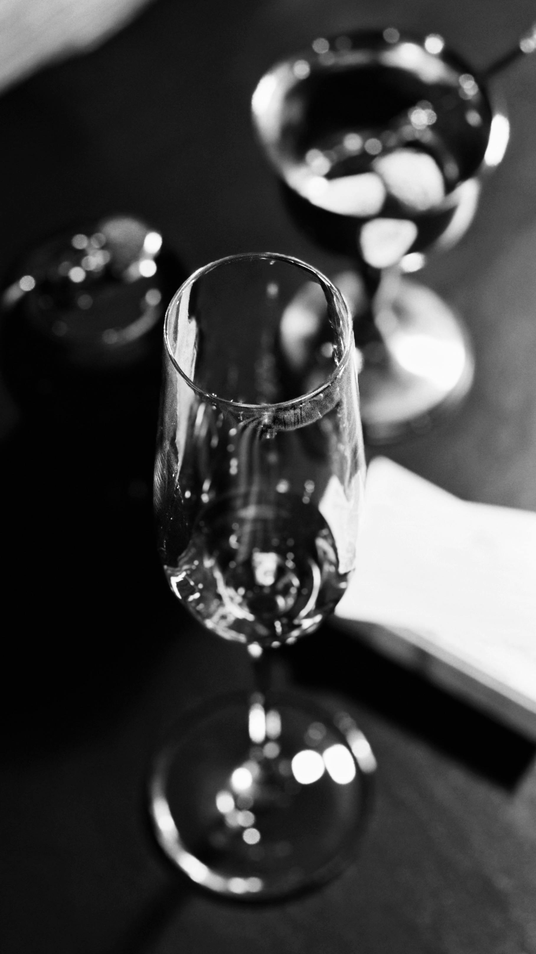 black and white photography of a champagne glass