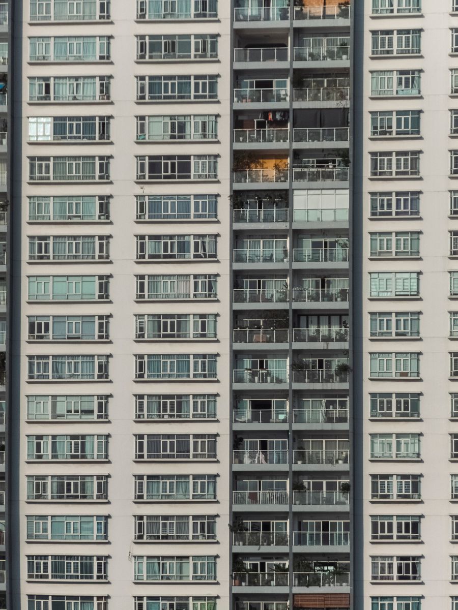 Modern residential apartment building exterior, representative of Listone Residence, International City