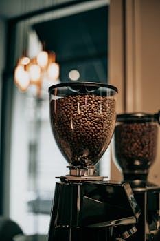 Close-up of coffee grinder with beans in a modern café in Baku, Azerbaijan.