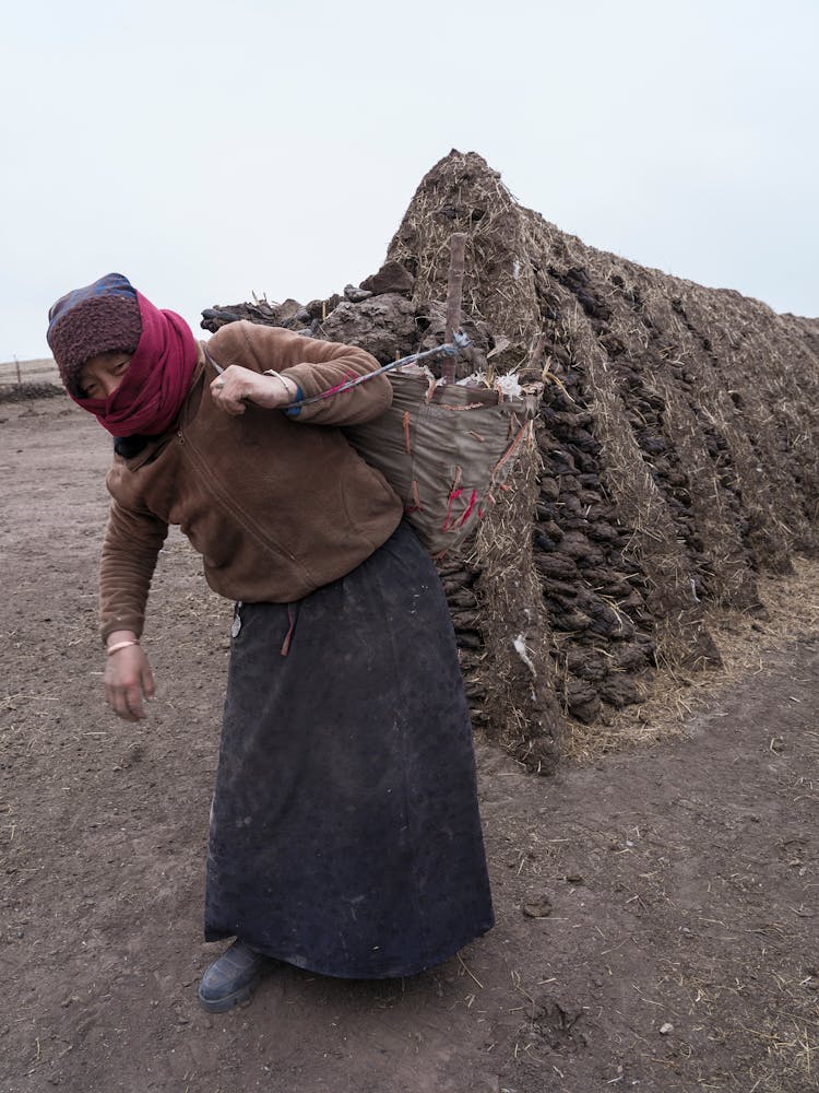 Woman Carrying Bag On Field