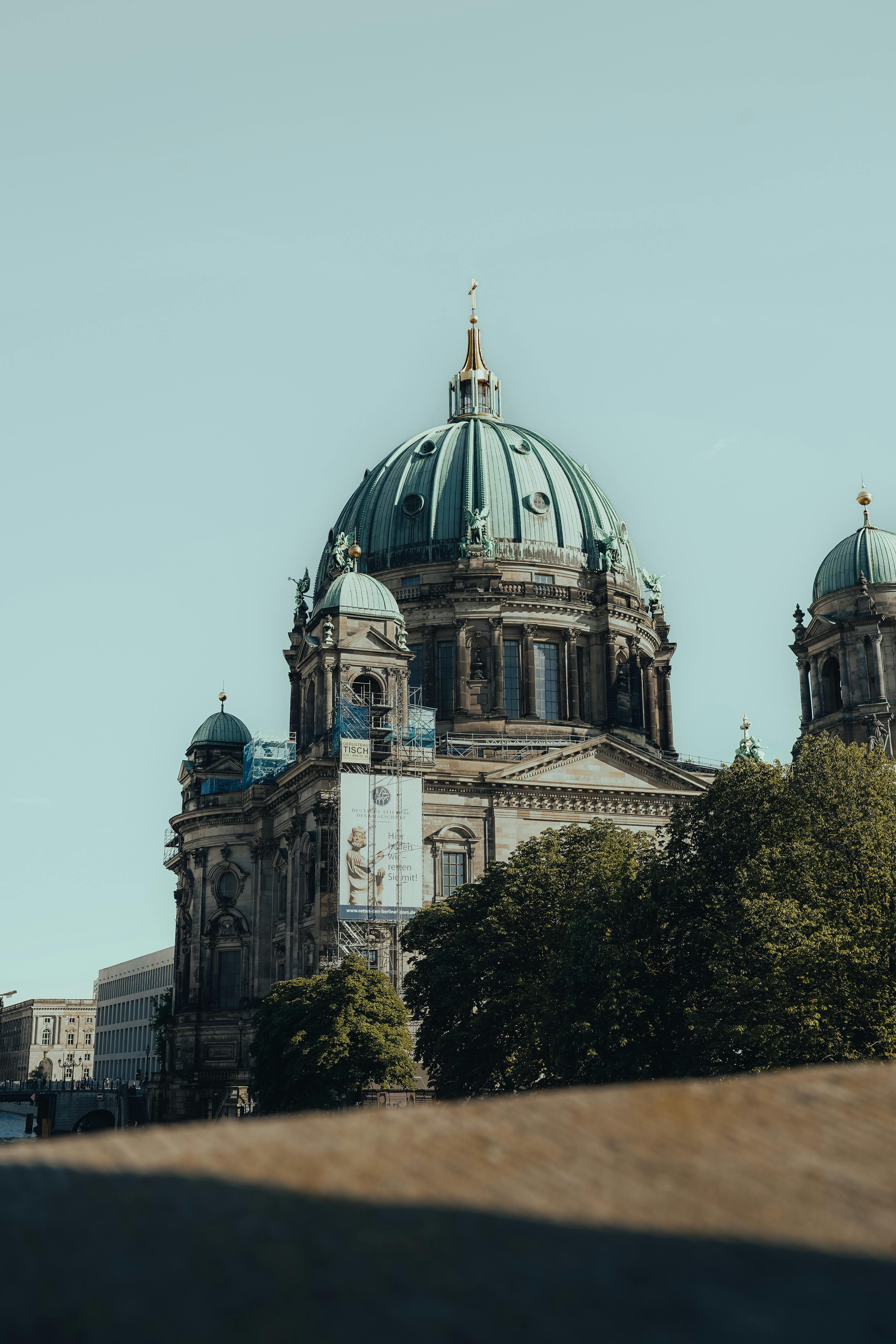 Captivating view of Berlin Cathedral with its iconic dome bathed in sunlight.