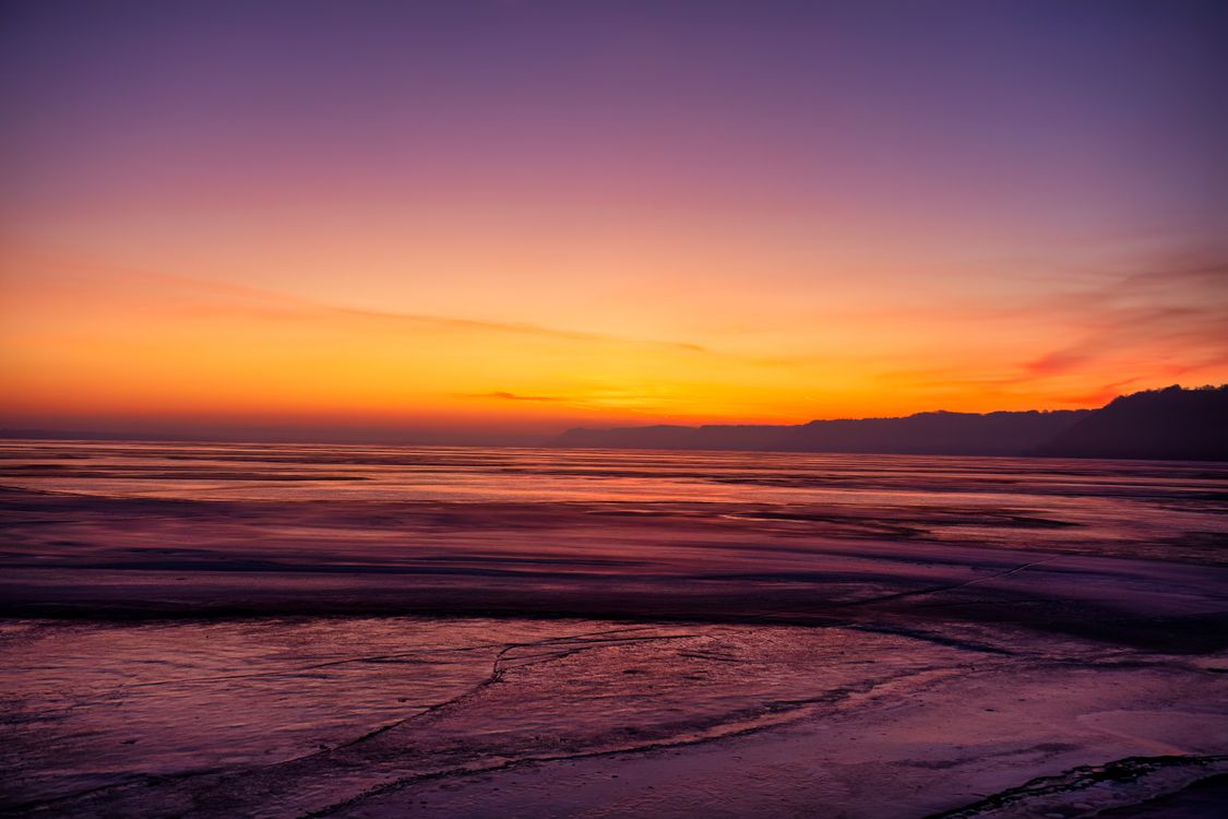 View of a Dramatic Sunset Sky over a Sea · Free Stock Photo
