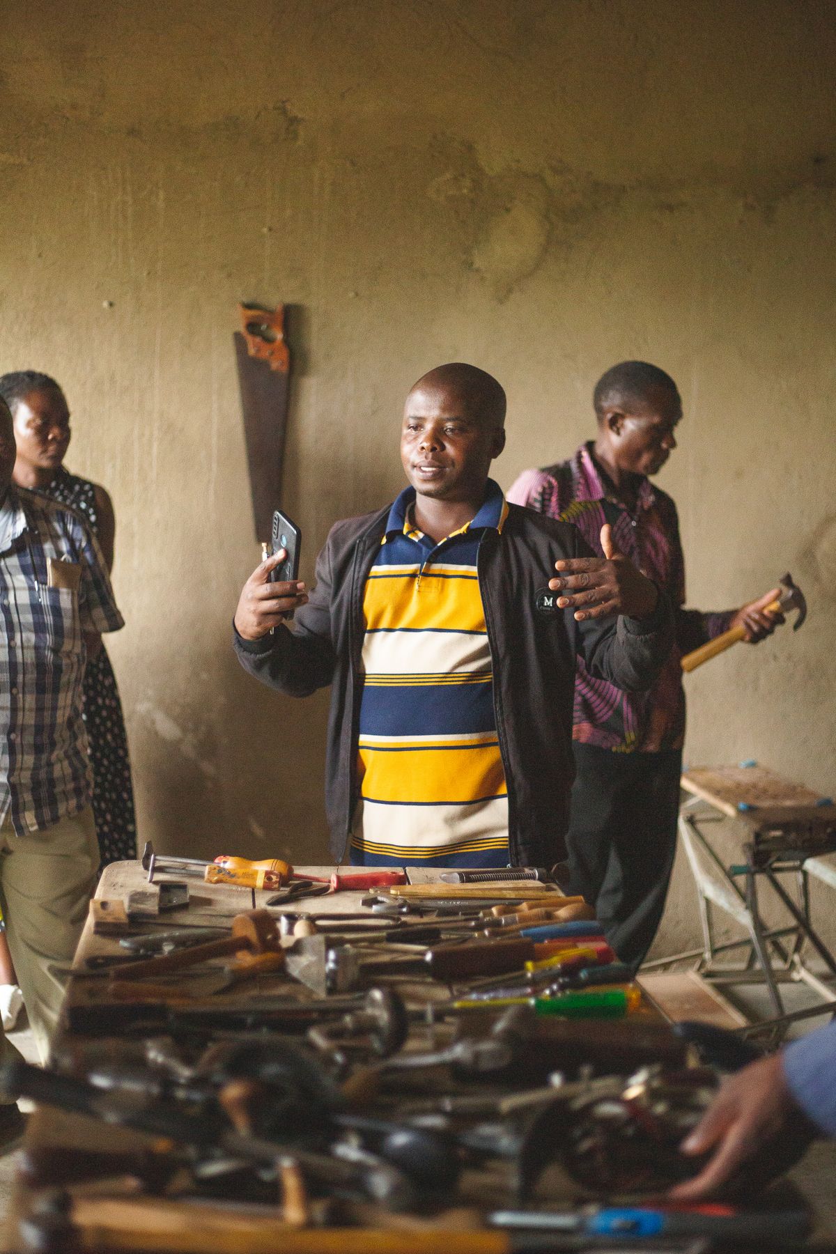 People taking part in a community workshop in Kasese, Uganda