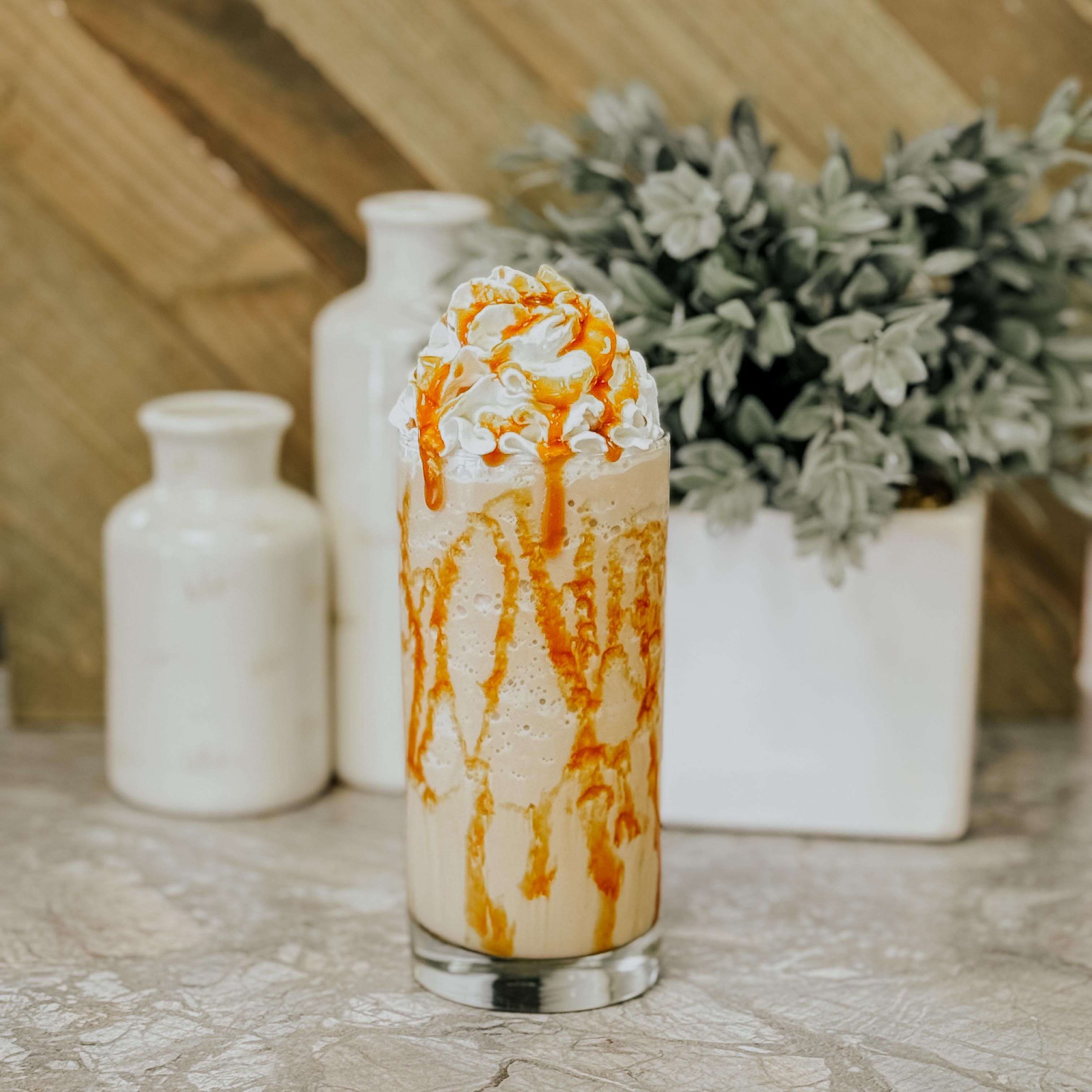 Blended iced coffee with whipped cream and caramel, photo by Jared Kaeb on Pexels