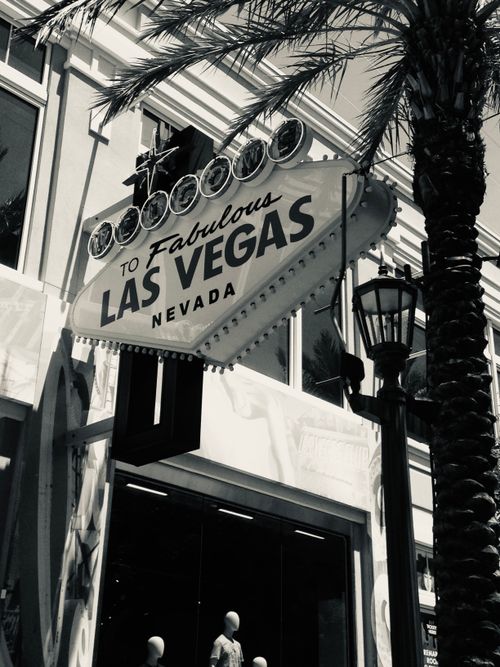 Free Monochrome image of the iconic Fabulous Las Vegas sign with palm trees, capturing urban vibes. Stock Photo