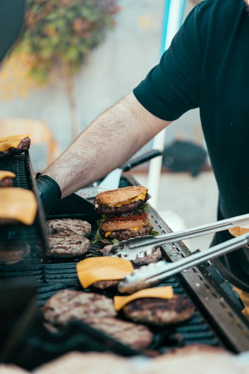 Man Making Burgers On Barbecue Free Stock Photo man-making-burgers-on-barbecue-free-stock-photo