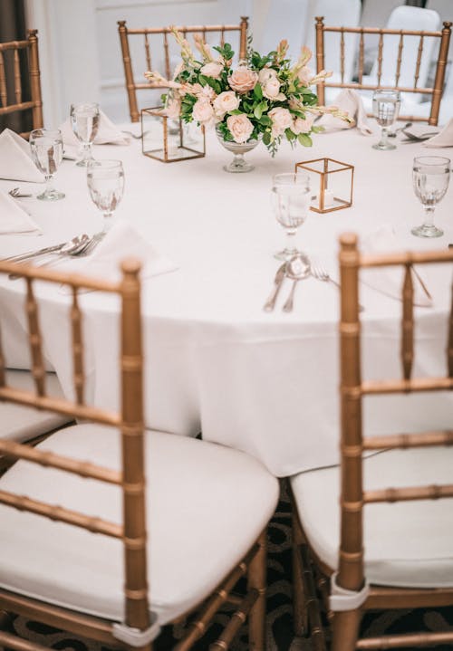 Flower Arrangement on Top of Table With Chairs
