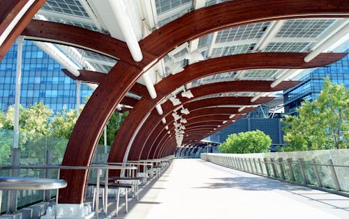 A walkway with wooden beams and metal supports