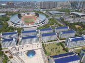 Aerial shot of Hengyang Sports Stadium with nearby urban and residential neighborhoods.