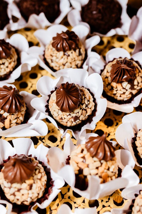 A close up of chocolate covered cupcakes