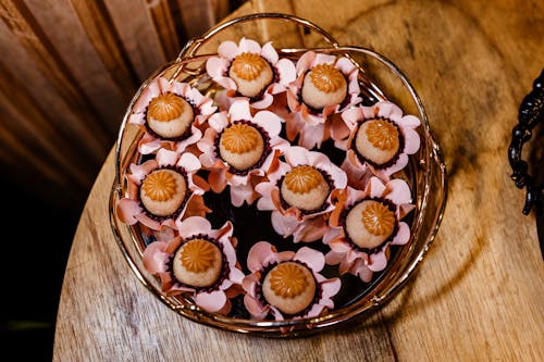 A bowl of chocolate covered strawberries on a wooden table