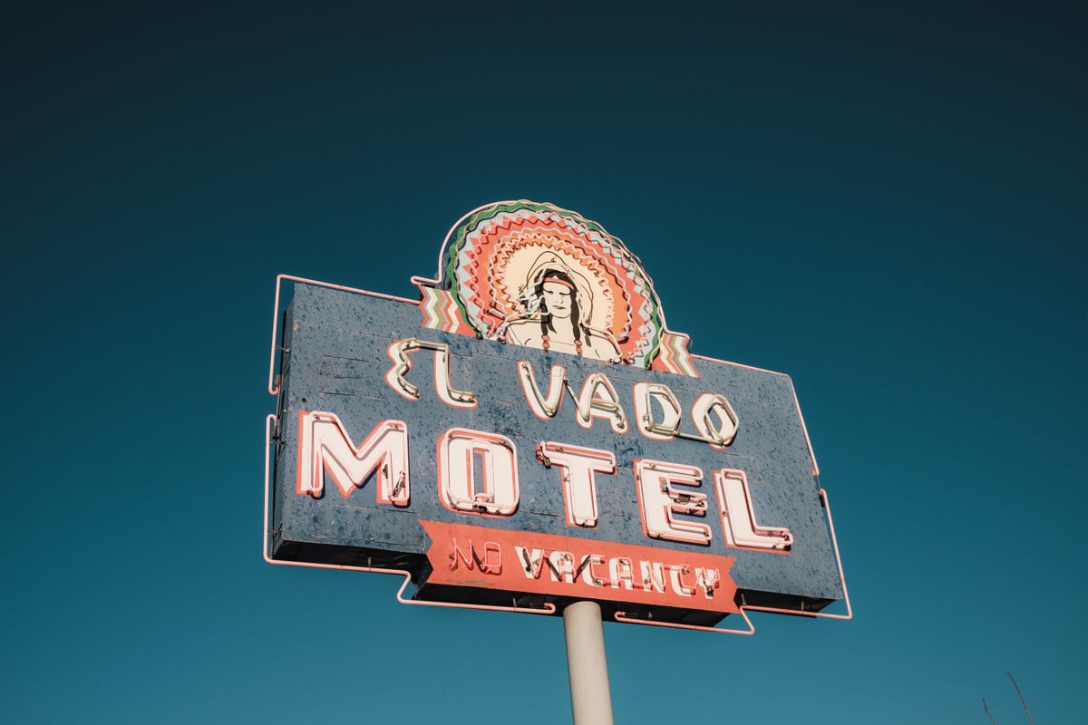 Vintage neon motel signage along historic southwestern highway route