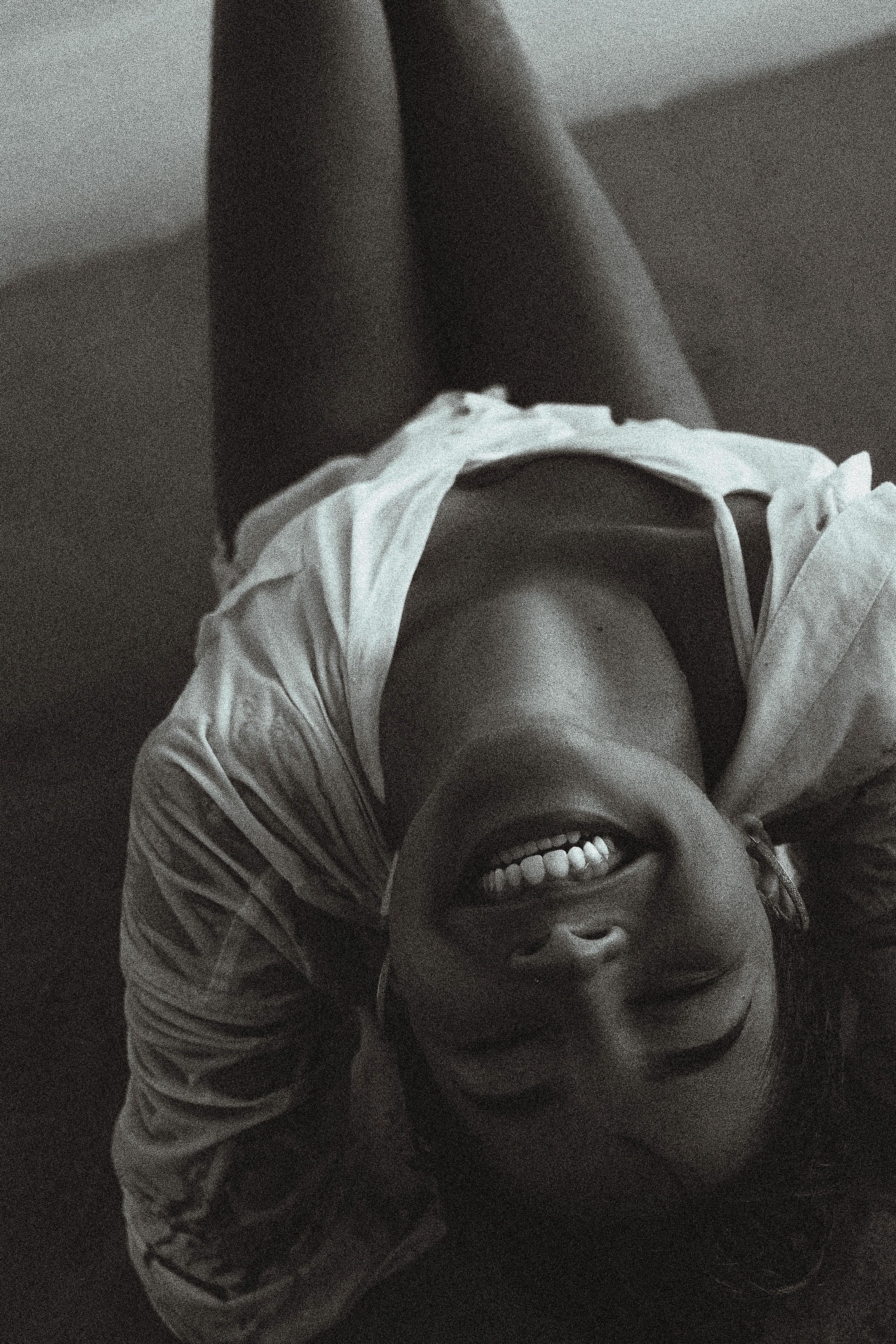 Black and White Photo of a Young Smiling Woman · Free Stock Photo