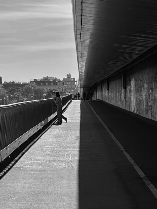 Free Couple standing in an urban setting, captured in black and white in Vienna. Stock Photo