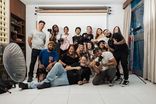 A group of people posing for a photo in a studio