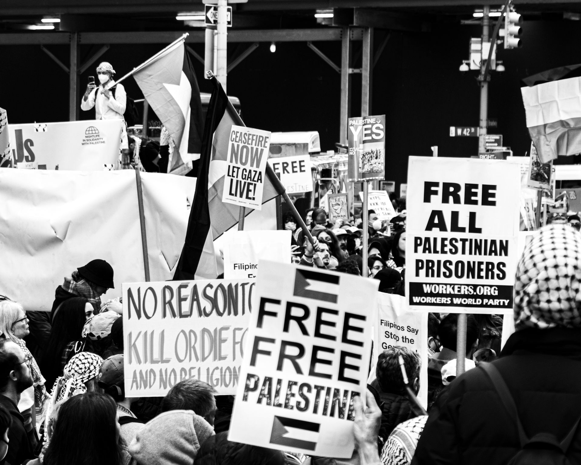 A powerful street protest advocating for Palestinian rights featuring diverse groups and passionate signs.