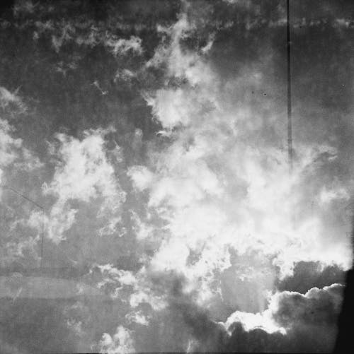 A black and white photo of clouds in the sky