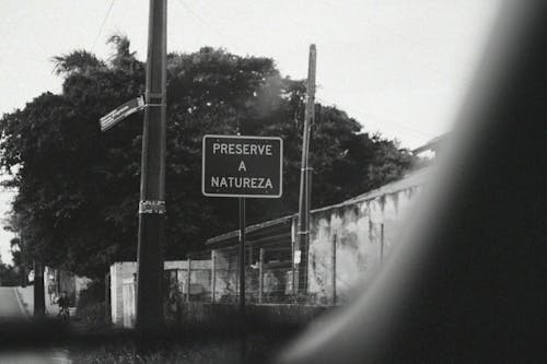 A black and white photo of a street sign