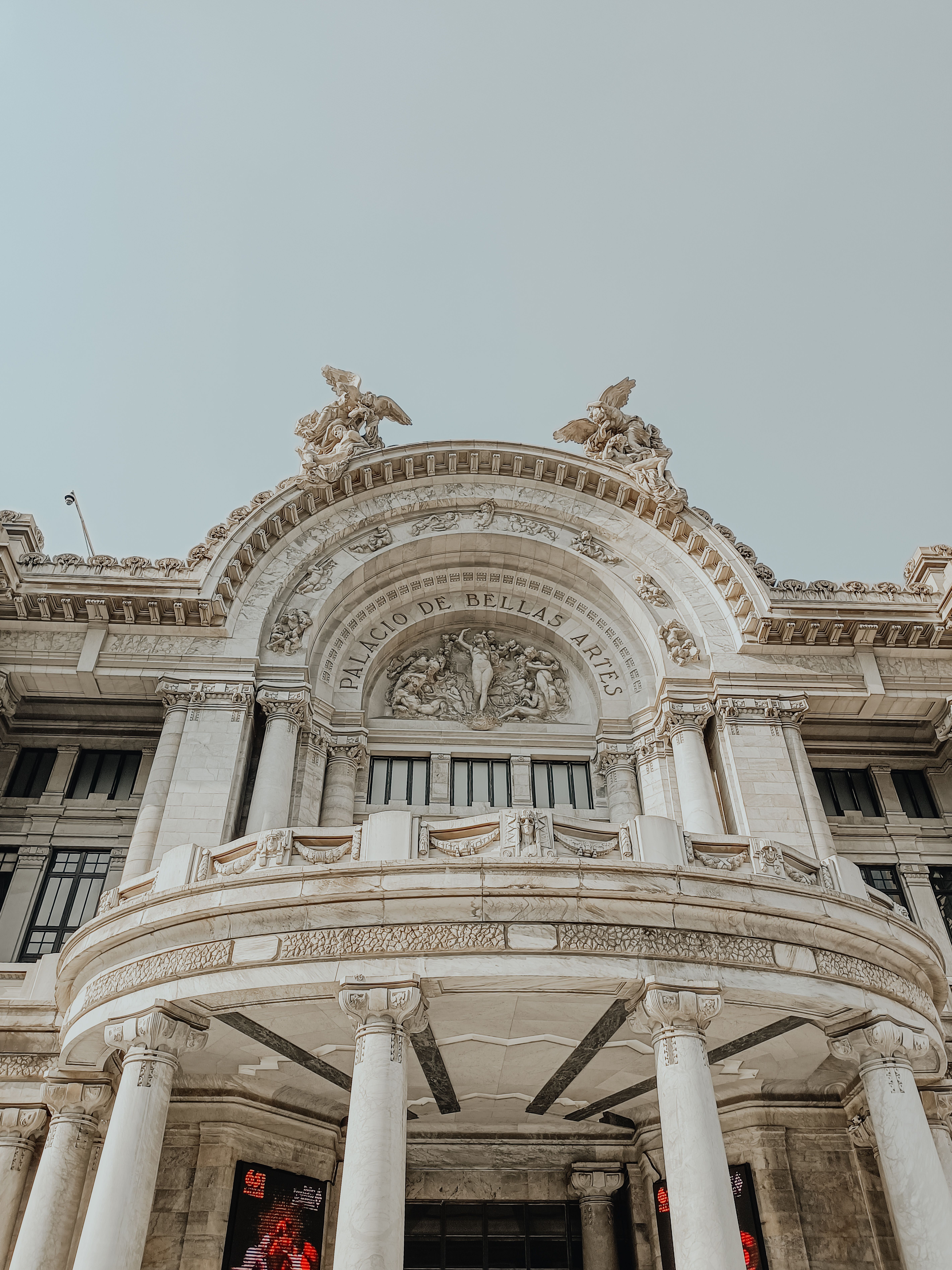 A detailed view of the ornate Palacio de Bellas Artes facade, highlighting neoclassical architecture in Mexico City.