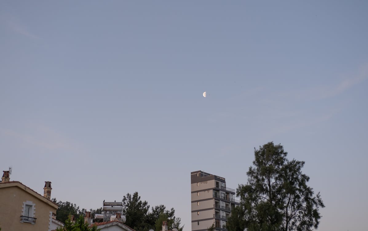 Free A picture of the moon over a city Stock Photo