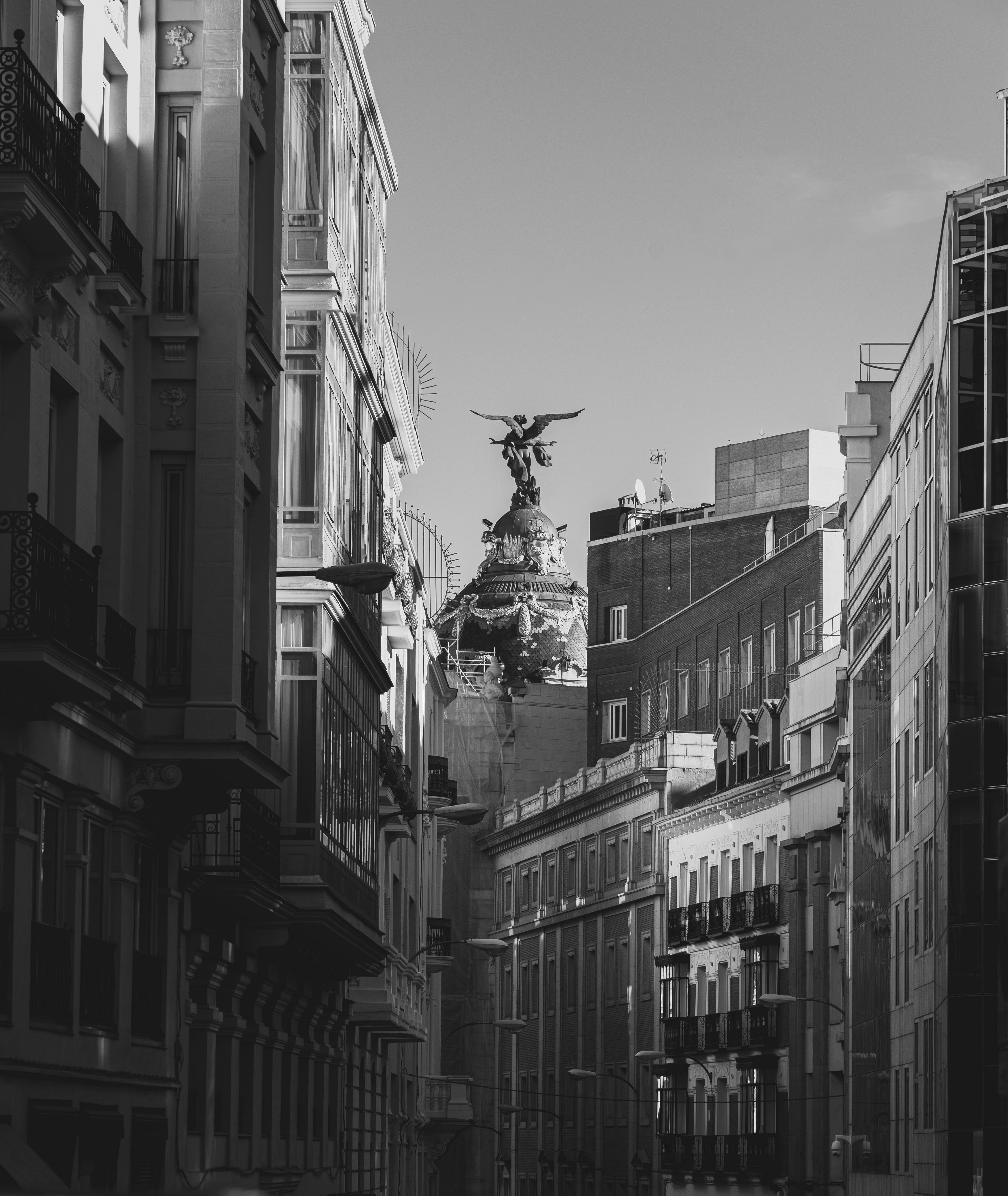 A dramatic black and white image of iconic architecture on Madrid's skyline showcasing urban European charm.