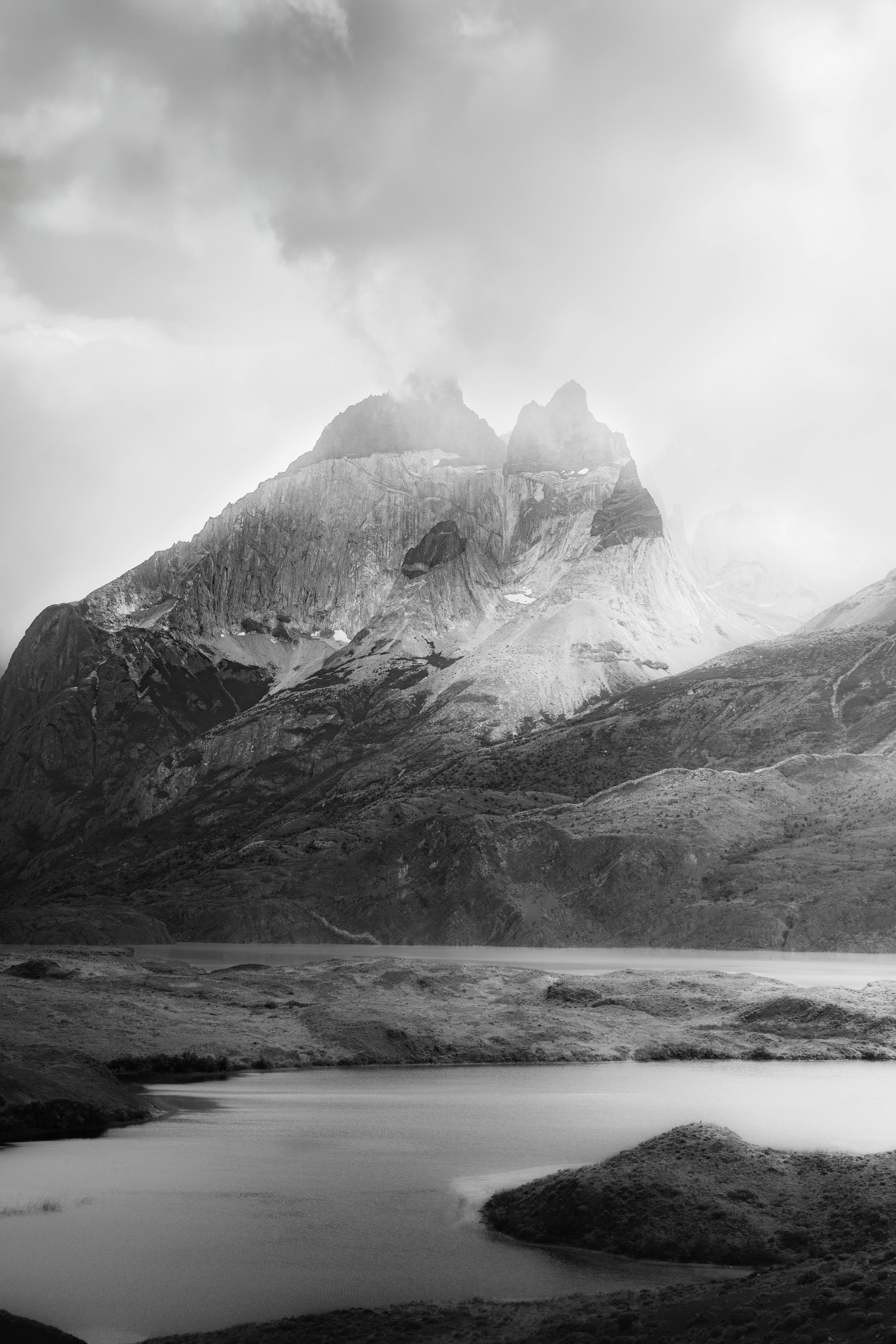 Stunning black and white landscape of rugged mountains in Puerto Natales, Chile.