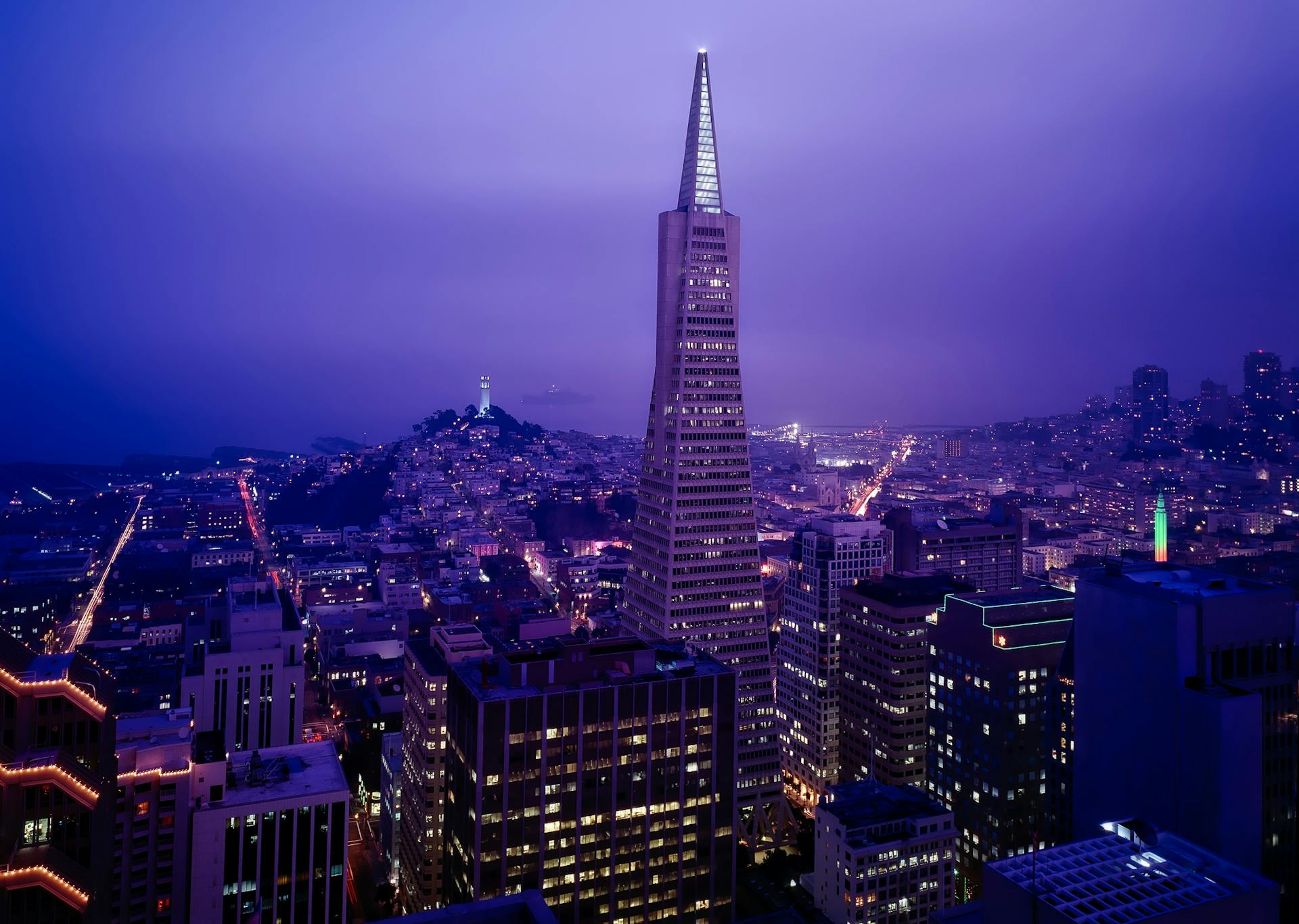Stunning nighttime view of the San Francisco skyline with lit-up Transamerica Pyramid.