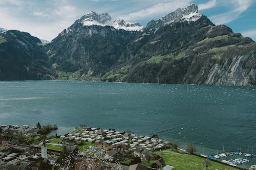 Village by Lake in Mountains