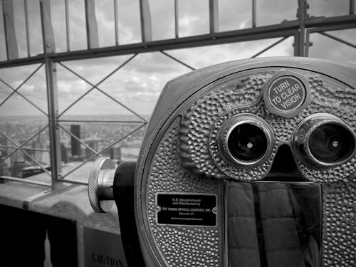 Black and white photo of a coin operated binoculars