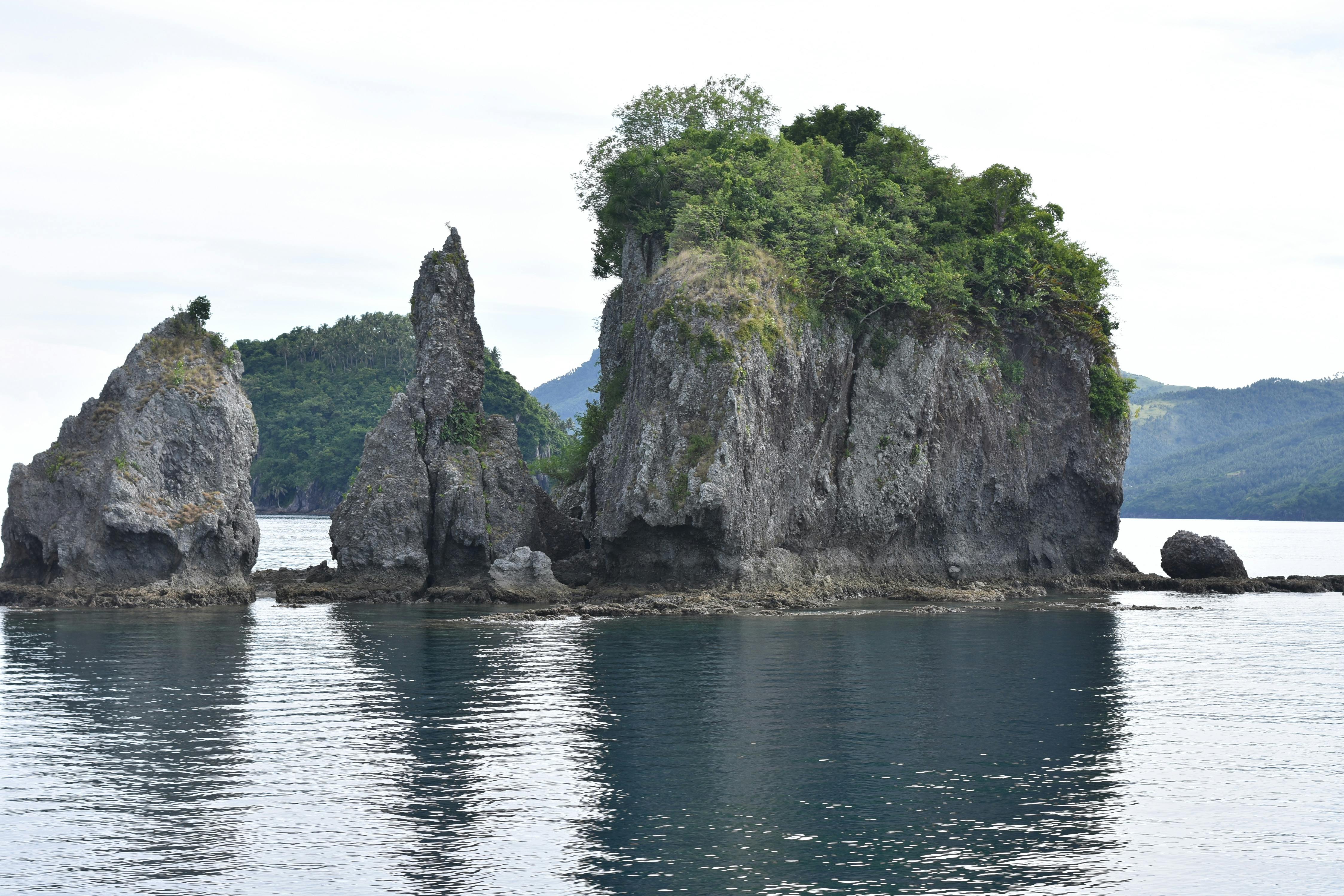 Captivating limestone cliffs and rock formations in Calbayog City's serene waters.