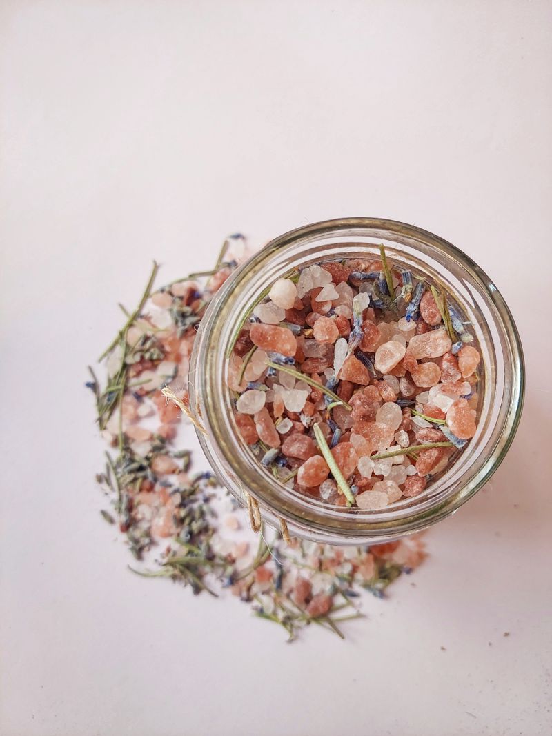 Himalayan salt mixed with herbs in a glass jar