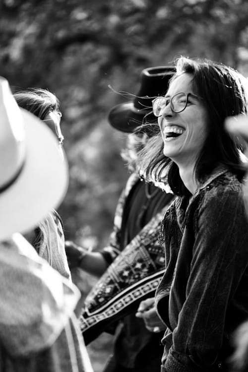 Free A woman in a hat and glasses laughing Stock Photo