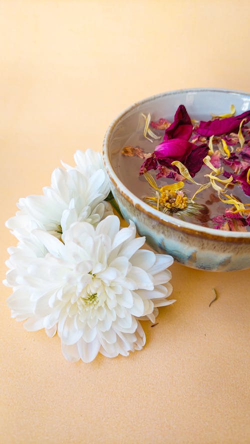 Chrysanthemums by Bowl with Flowers in Water