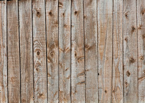 Free Wooden fence background with weathered wood Stock Photo