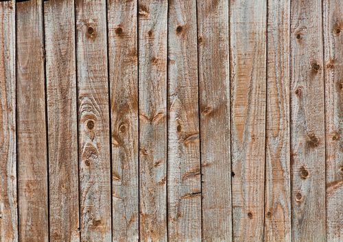 Free Close-up of a rustic wooden wall showing intricate grain patterns and aged texture. Stock Photo