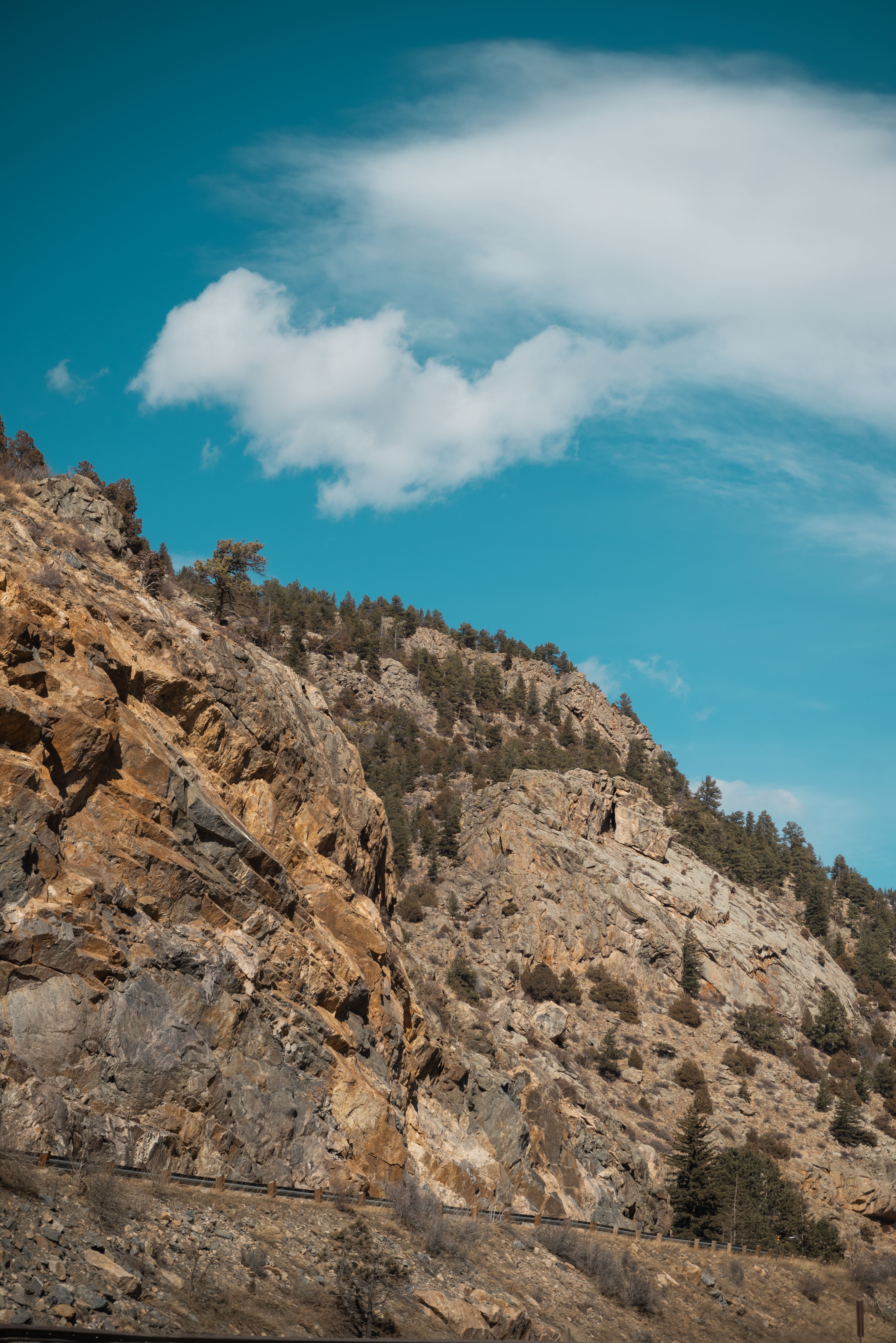 View of a Rocky Mountain under a Blue Sky · Free Stock Photo