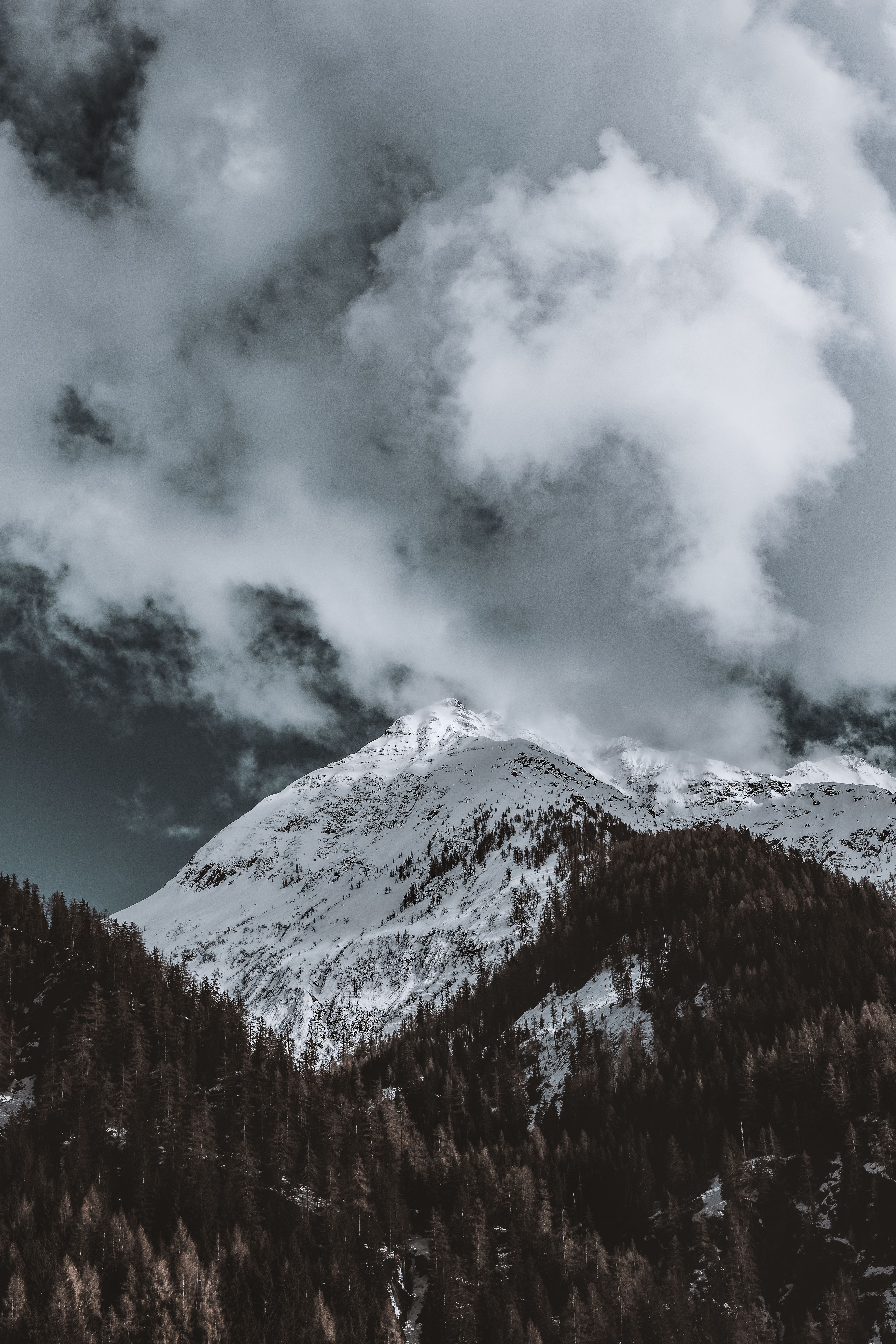 Photo of Snow Capped Mountain Under Cloudy Sky · Free Stock Photo
