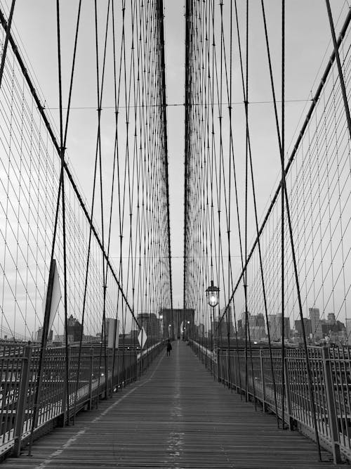 A black and white photo of the brooklyn bridge