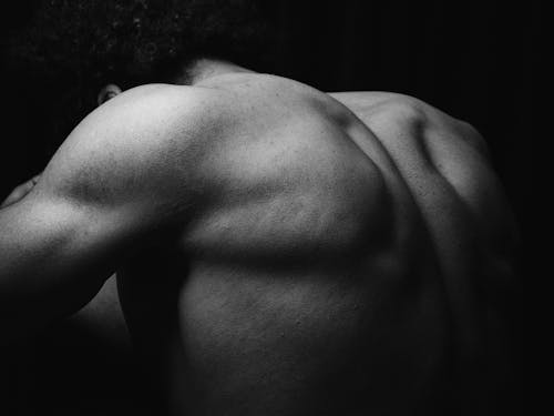 Free A black and white photo of a man's back Stock Photo