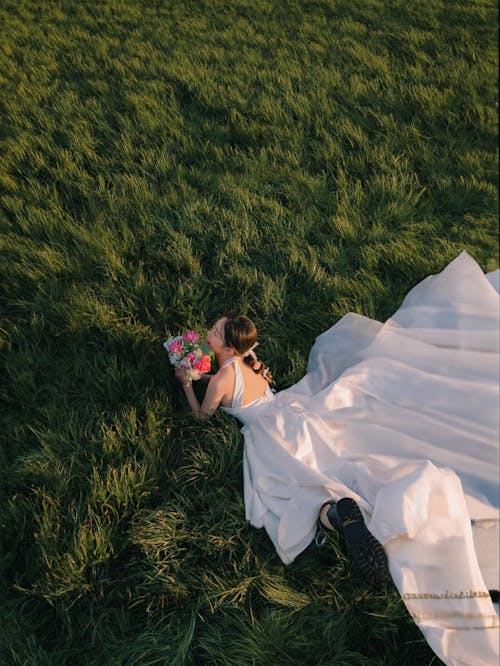 character  lie down on the Grassy meadows in  long white  curseol dress  | @lostintespace • by Amaan
