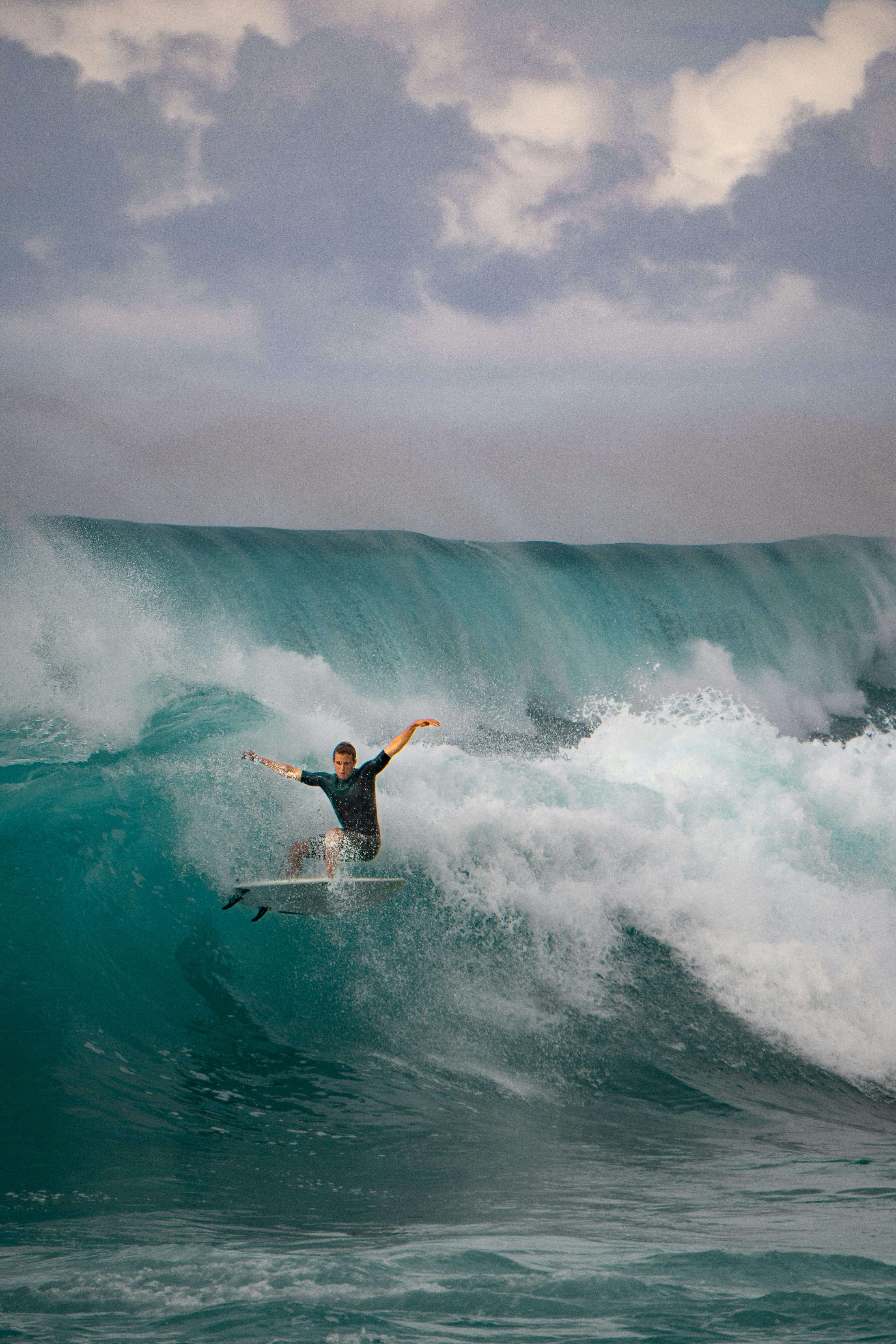 Surfer masters a powerful wave in Haleiwa, HI, showcasing the thrill of ocean sports.