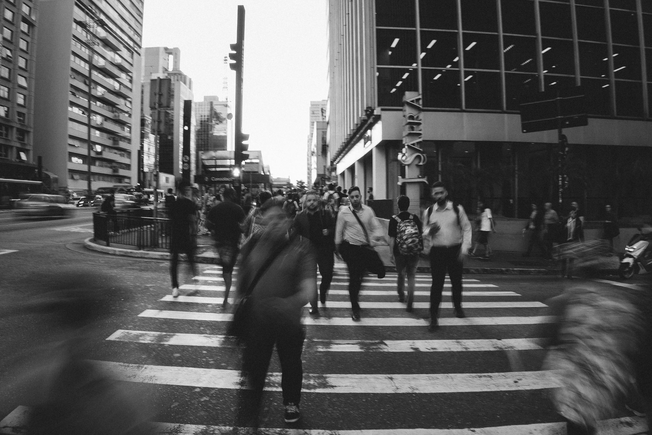 Grayscale Photo of Crossing The Road