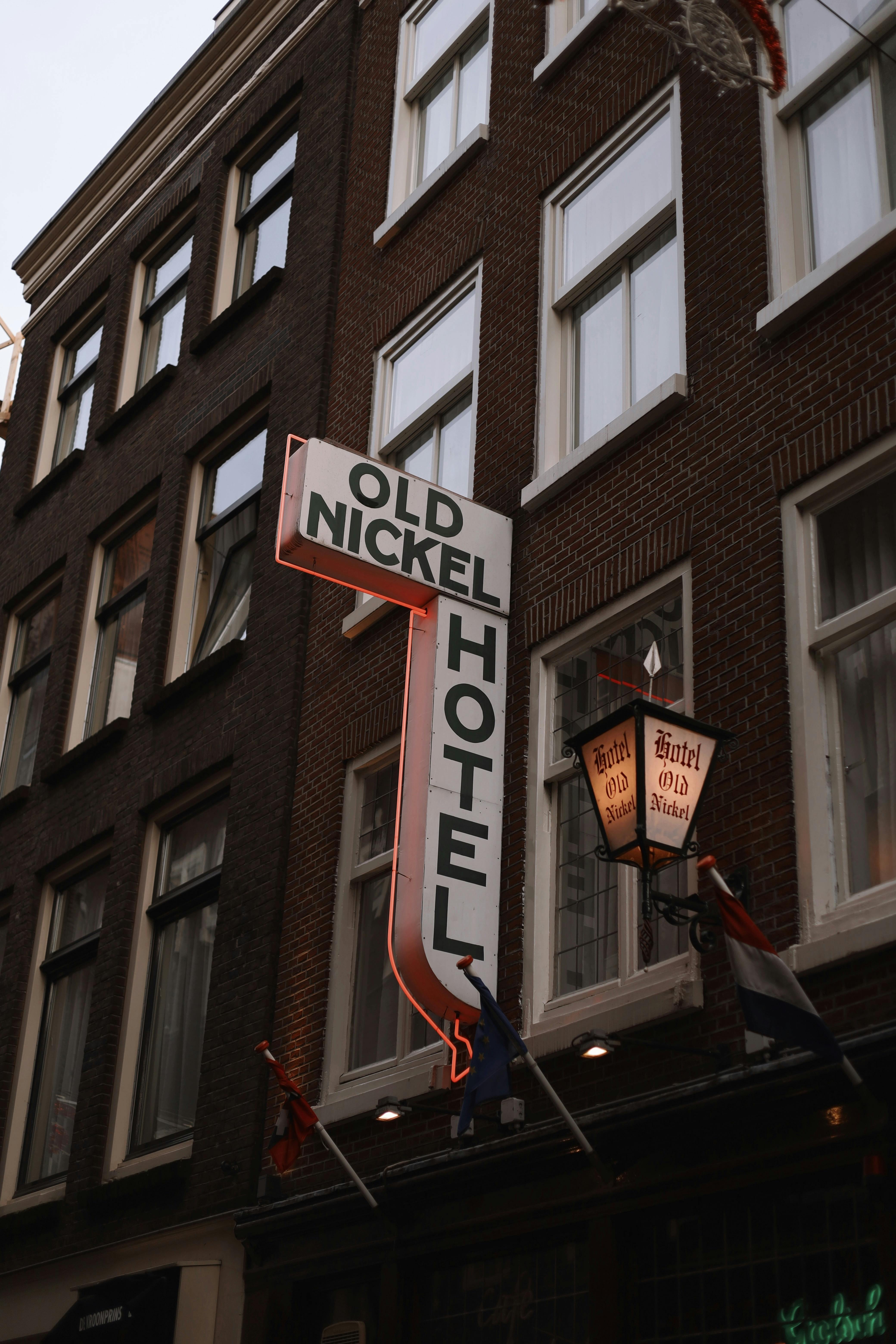 Historic Old Nickel Hotel sign in Amsterdam, capturing urban architecture and travel essence.