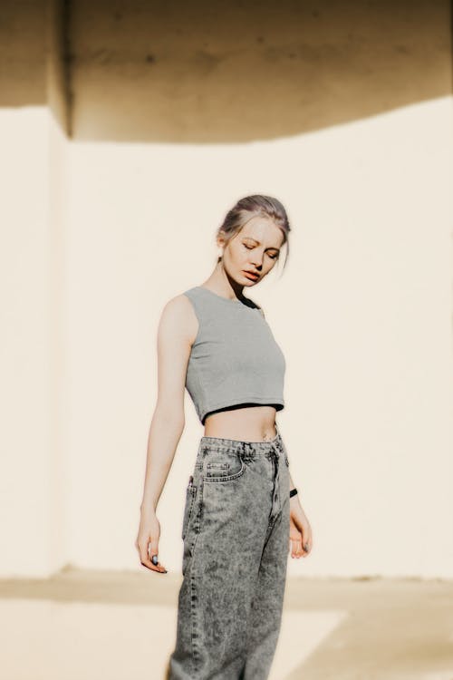 Woman in Gray Jeans and Gray Crop Top