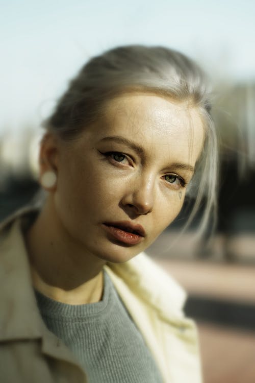 Blonde Woman with Heart Tattooed under Eye