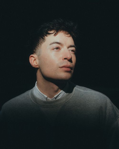 Free Dramatic studio portrait of a fashionable man in a pullover. Stock Photo